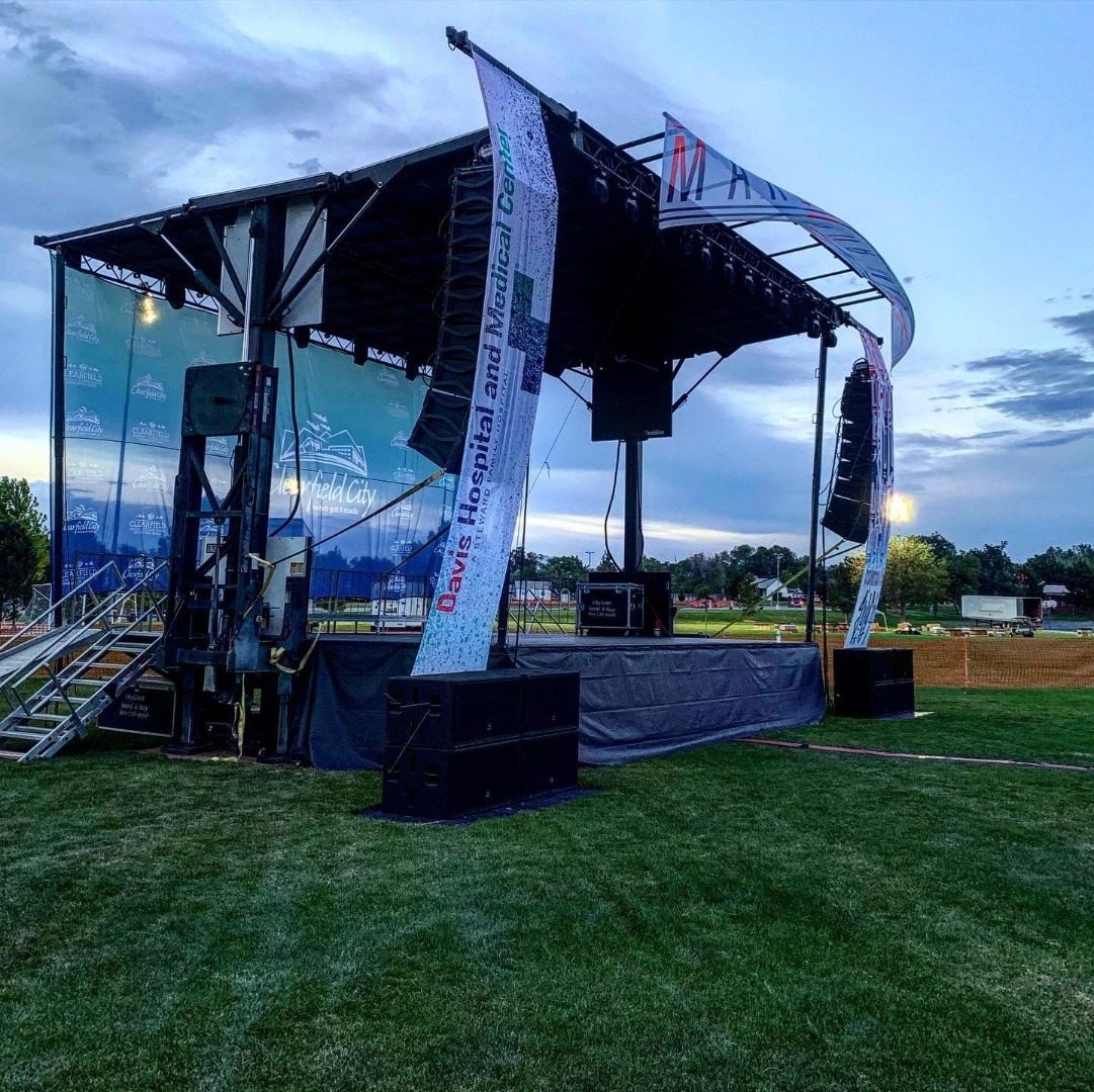 Professional outdoor stage setup at Clearfield City event with line array speakers