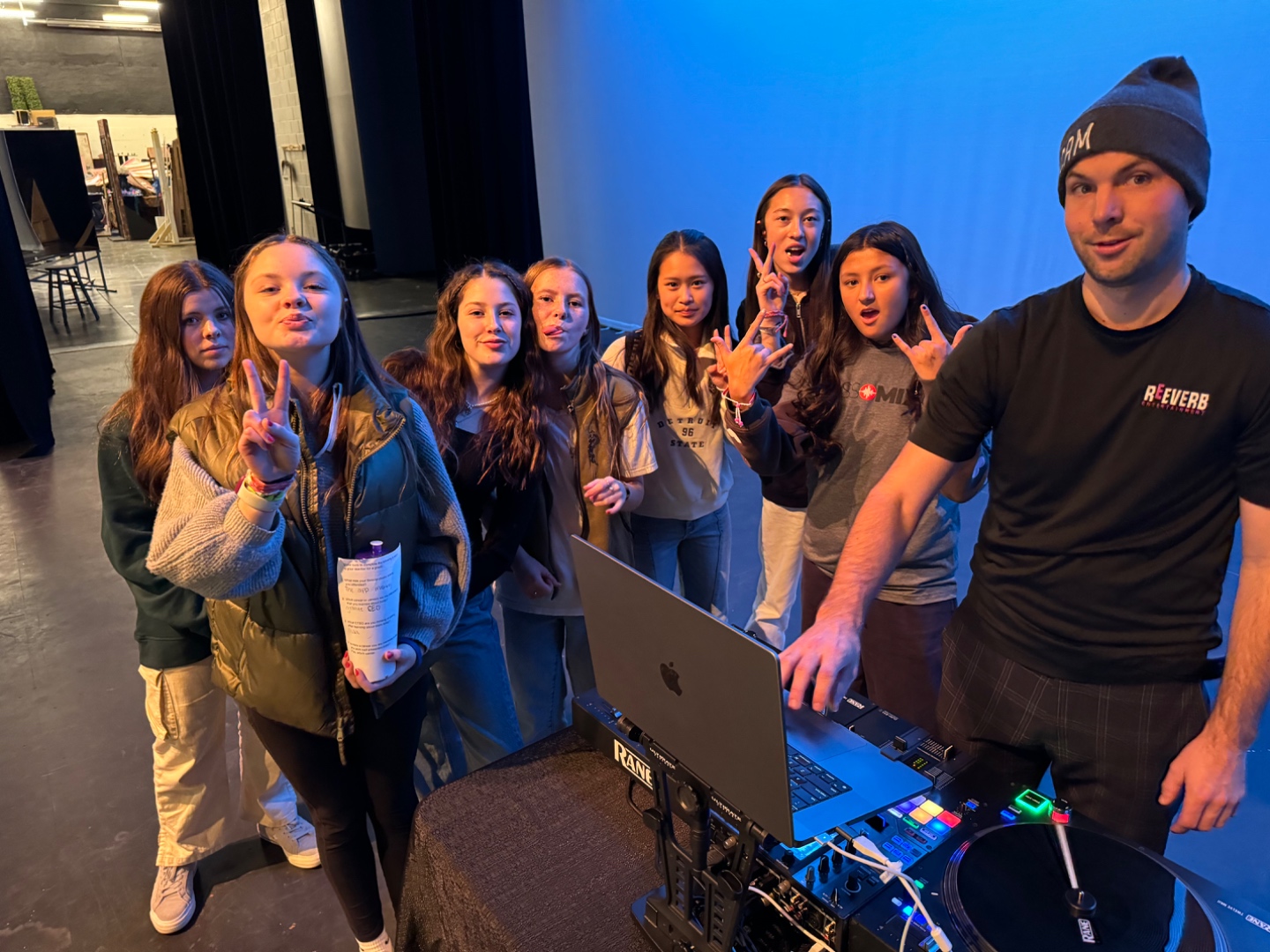 Mark from SwissMixx Audio with students at a DJ booth during a career day education program in the Treasure Valley Idaho