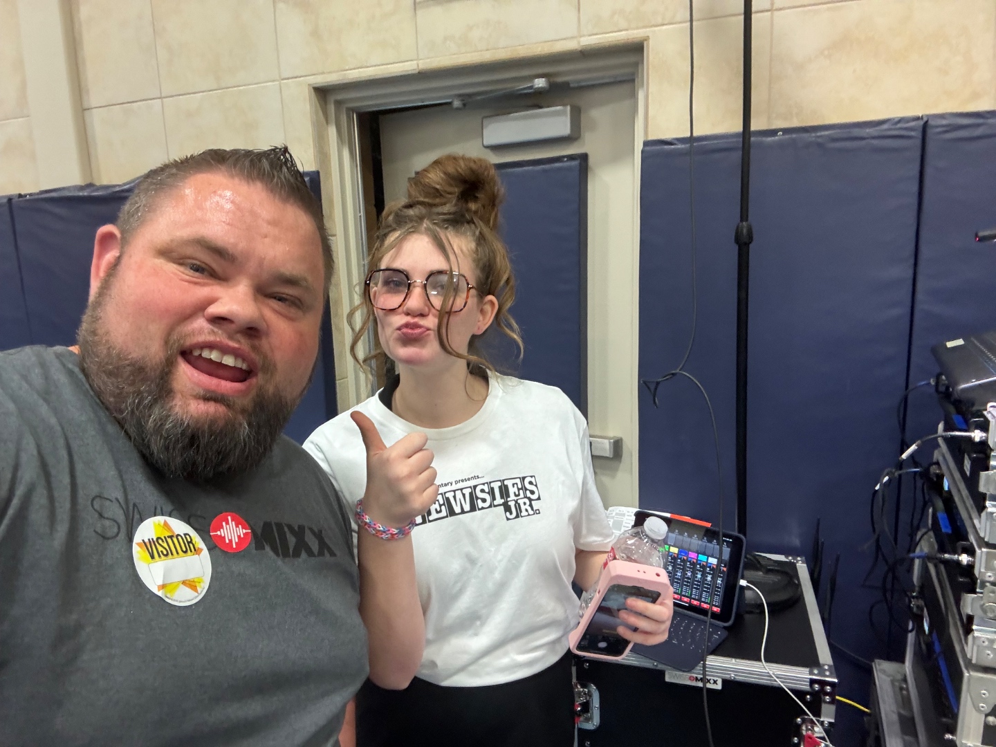 Student holding tablet mixer during Newsies Jr school production sound check, SwissMixx Audio youth training Idaho