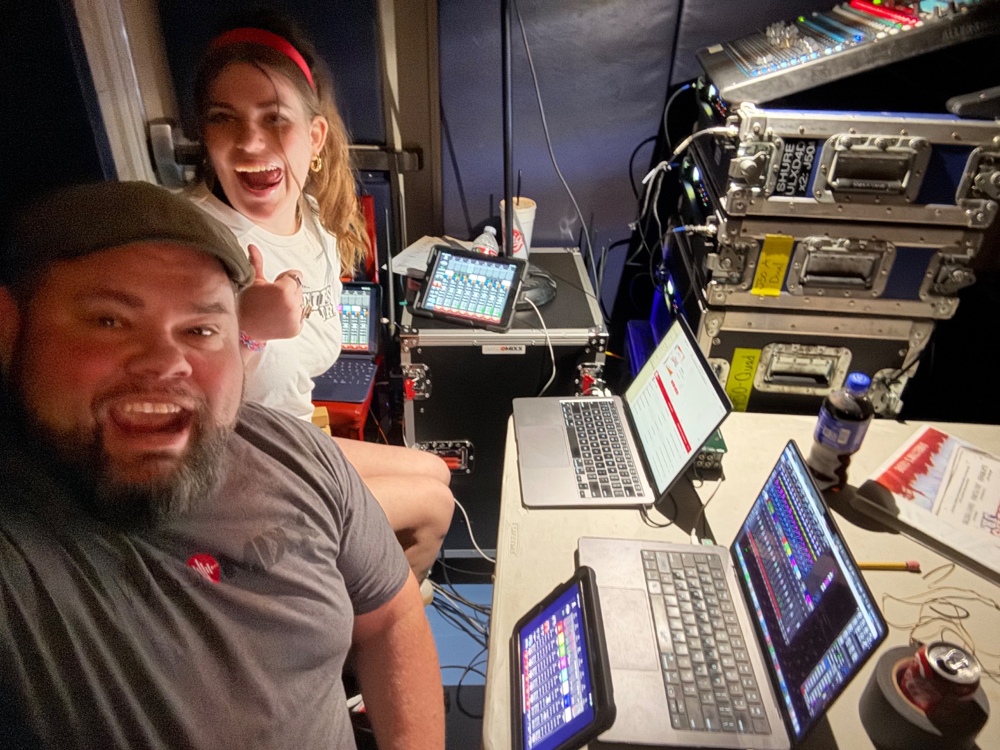 Mark and student in school production control booth running digital mixing console, theatre sound education Treasure Valley