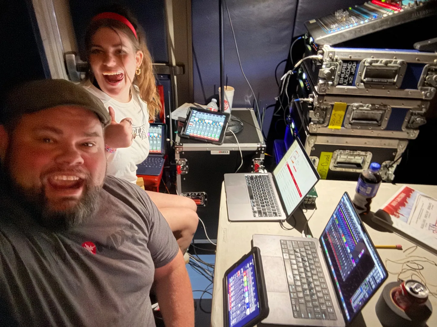 Mark and student in school production control booth running digital mixing console, theatre sound education Treasure Valley