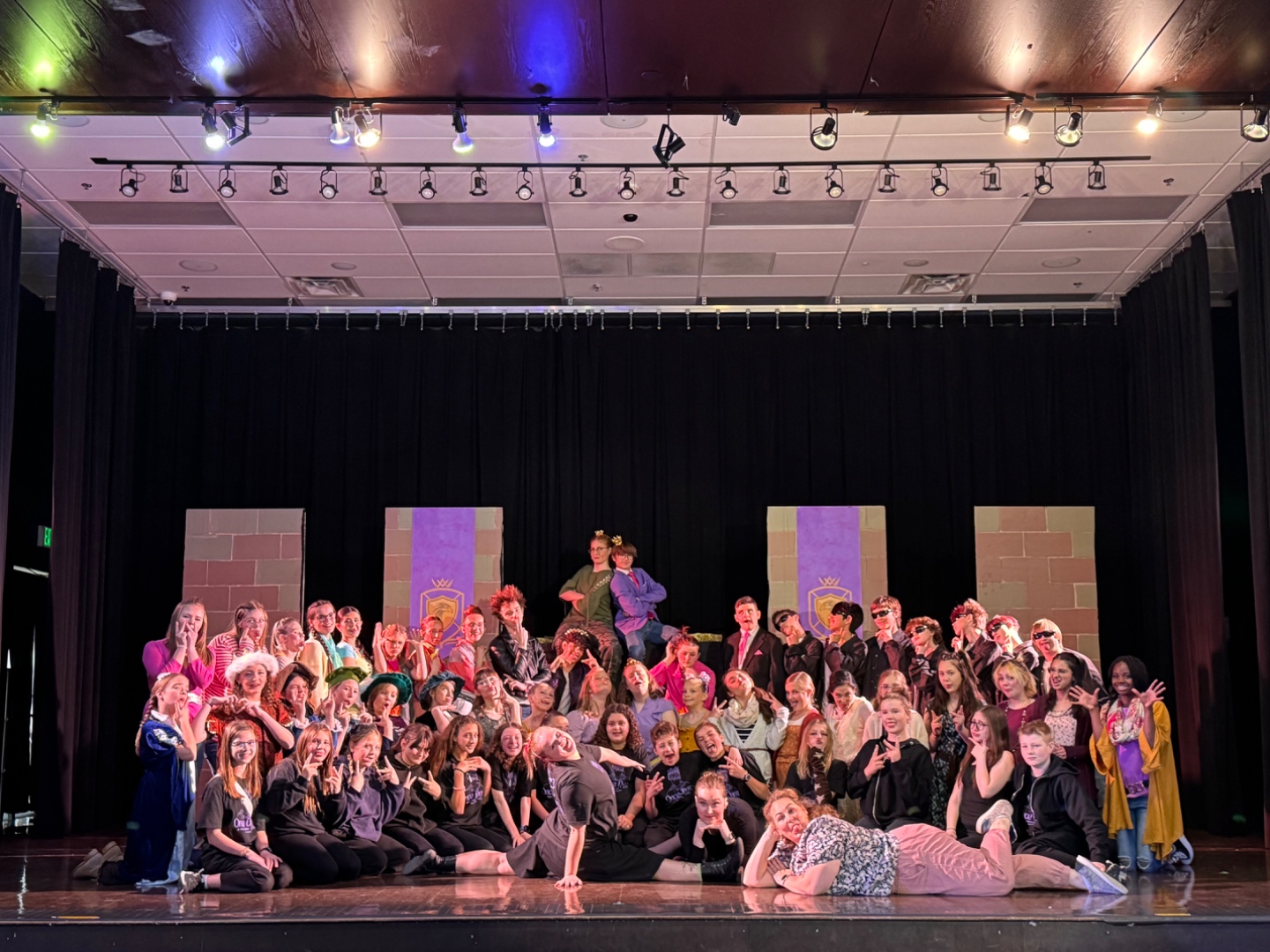 Full school cast on stage during colorful musical production, professional audio by SwissMixx Audio Boise Idaho