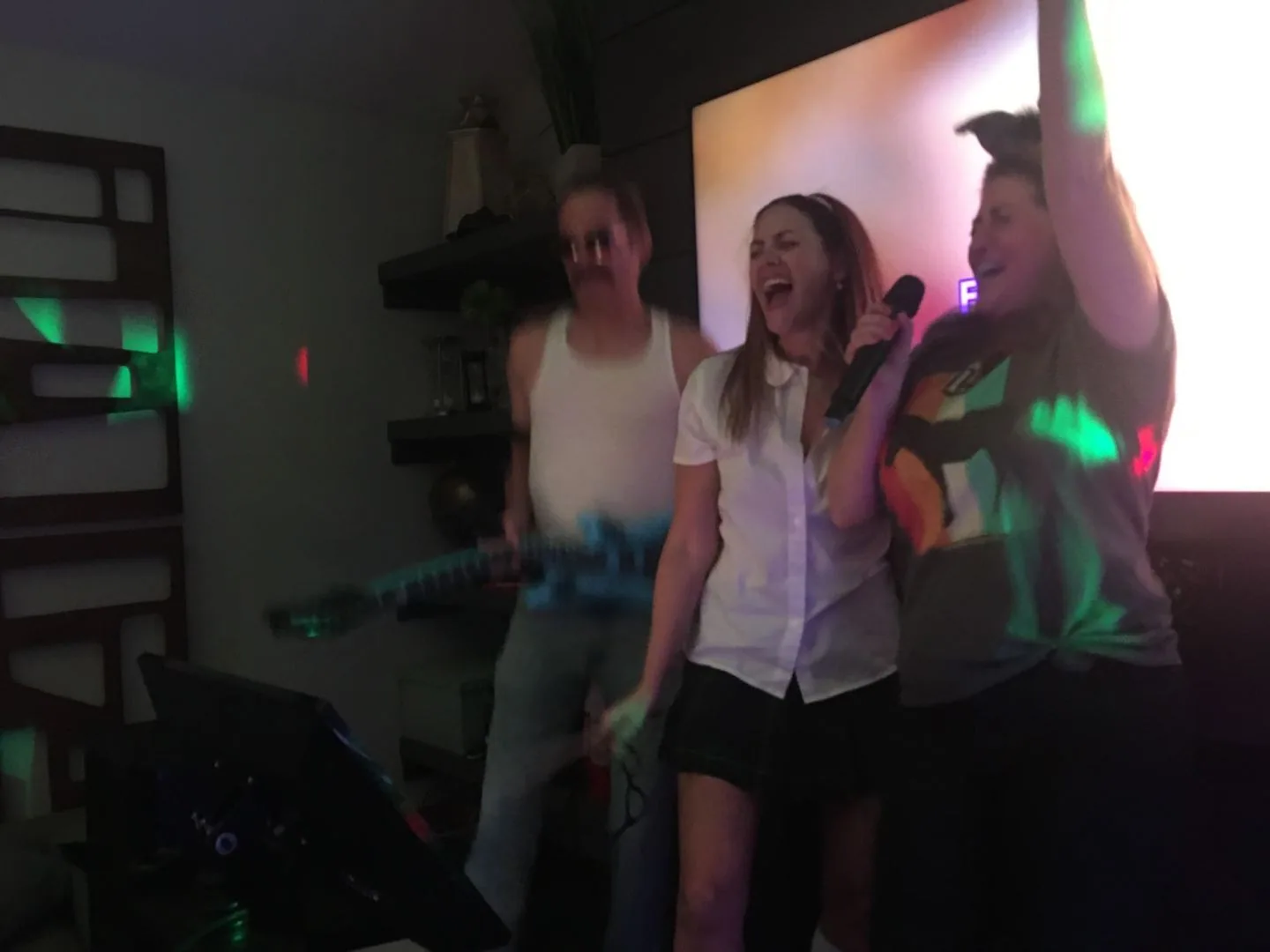Friends at a backyard party with rented PA speaker and microphone, SwissMixx Audio Treasure Valley