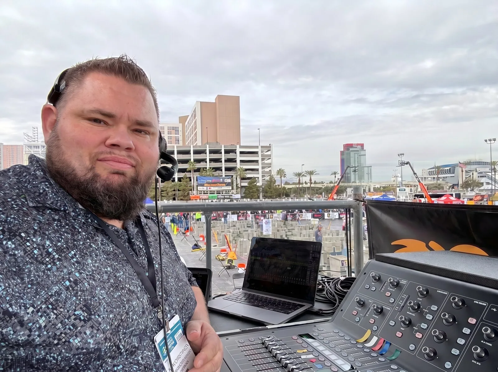Mark Christiansen SwissMixx Audio production supervisor at FOH mixing console at a major outdoor event in Las Vegas