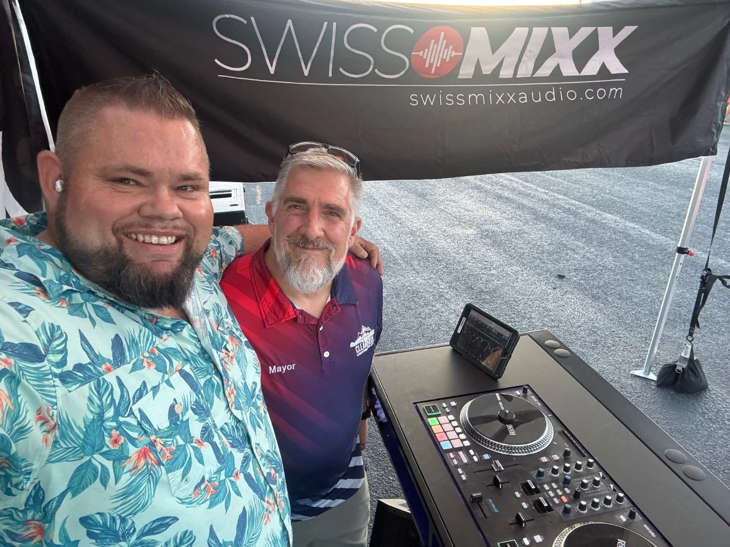 Mark Christiansen taking a selfie with the local Mayor at the SwissMixx Audio DJ booth during a community event in the Treasure Valley