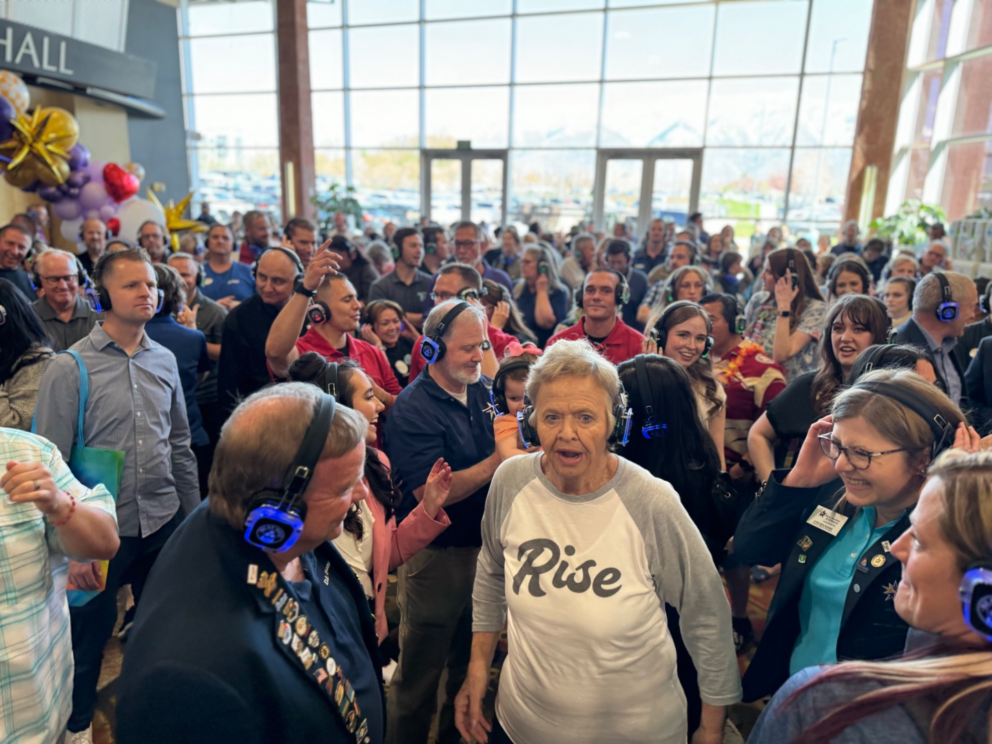 Large crowd of hundreds wearing SwissMixx Audio silent disco headsets at a community event in Boise Idaho Treasure Valley