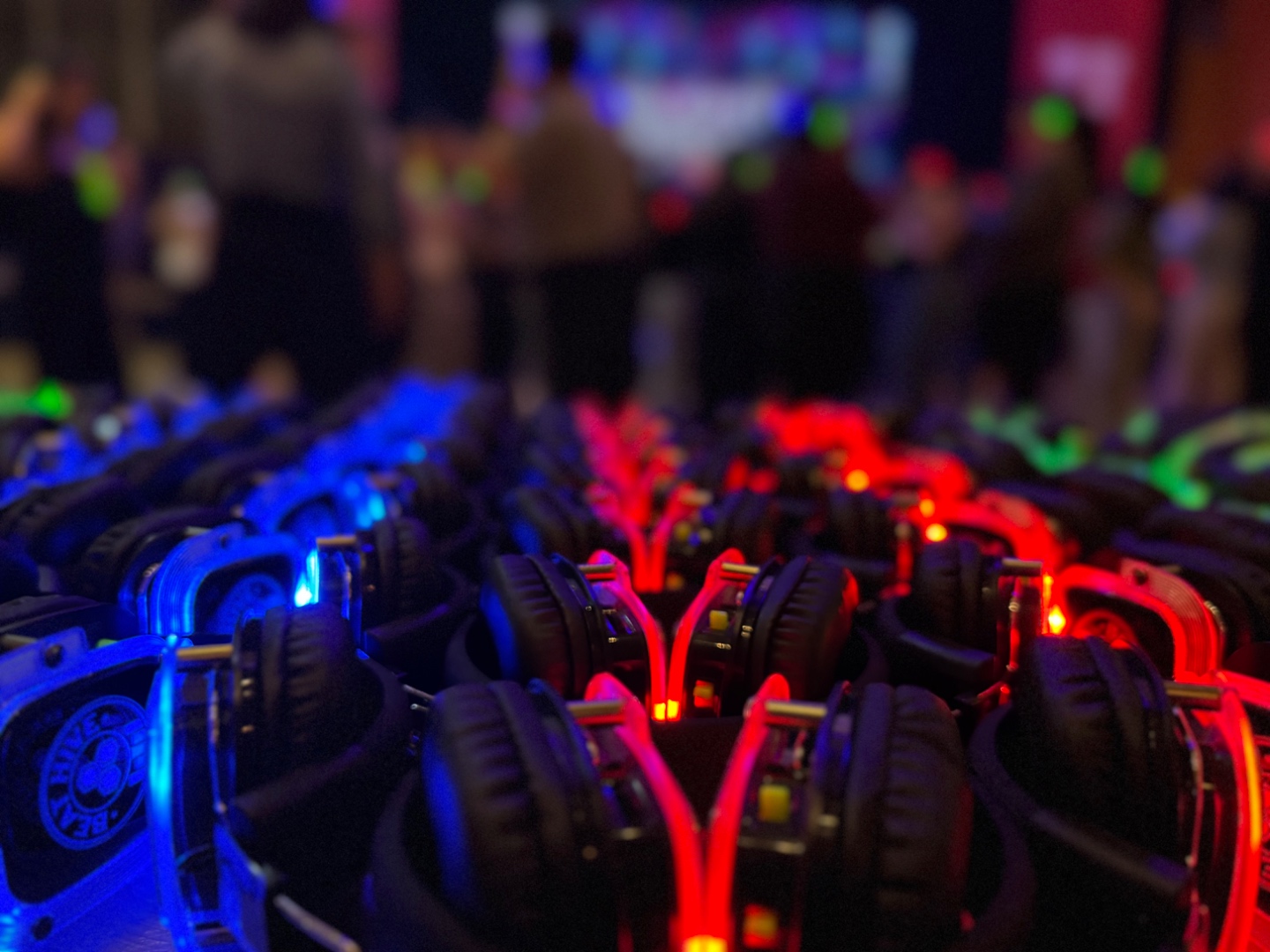 SwissMixx Audio 3-channel LED silent disco wireless headsets glowing blue and red, rental in Boise Idaho Treasure Valley up to 100 guests