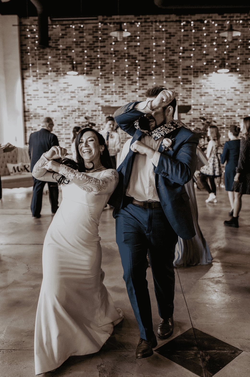 Bride and groom dancing at indoor wedding reception with string lights, SwissMixx Audio Boise Idaho